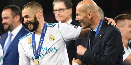Real Madrid's French coach Zinedine Zidane (R), Real Madrid's French forward Karim Benzema (C) and Real Madrid's Portuguese forward Cristiano Ronaldo (L) celebrate after winning the UEFA Champions League final football match between Liverpool and Real Madrid at the Olympic Stadium in Kiev, Ukraine, on May 26, 2018. (Photo by FRANCK FIFE / AFP) (Photo credit should read FRANCK FIFE/AFP/Getty Images)