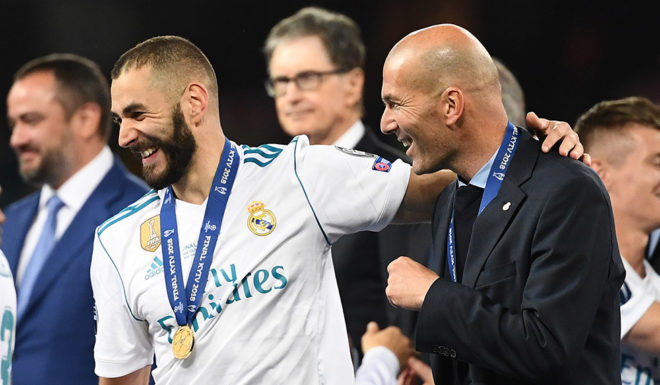 Real Madrid's French coach Zinedine Zidane (R), Real Madrid's French forward Karim Benzema (C) and Real Madrid's Portuguese forward Cristiano Ronaldo (L) celebrate after winning the UEFA Champions League final football match between Liverpool and Real Madrid at the Olympic Stadium in Kiev, Ukraine, on May 26, 2018. (Photo by FRANCK FIFE / AFP) (Photo credit should read FRANCK FIFE/AFP/Getty Images)