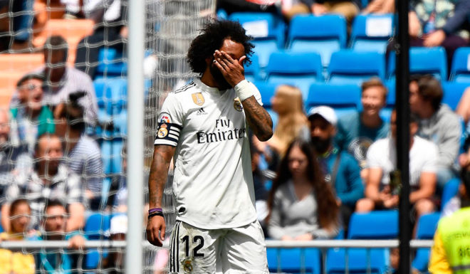 Real Madrid's Brazilian defender Marcelo reacts after Real Betis scored a second goal during the Spanish League football match between Real Madrid and Real Betis at the Santiago Bernabeu stadium in Madrid on May 19, 2019. (Photo by PIERRE-PHILIPPE MARCOU / AFP) (Photo credit should read PIERRE-PHILIPPE MARCOU/AFP/Getty Images)