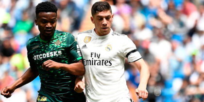 Real Madrid's Uruguayan midfielder Federico Valverde (R) challenges Real Betis' Cameroonian midfielder Wilfrid Kaptoum during the Spanish League football match between Real Madrid and Real Betis at the Santiago Bernabeu stadium in Madrid on May 19, 2019. (Photo by PIERRE-PHILIPPE MARCOU / AFP) (Photo credit should read PIERRE-PHILIPPE MARCOU/AFP/Getty Images)
