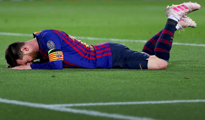 BARCELONA, SPAIN - MAY 01: Lionel Messi of Barcelona lies on the pitch after the UEFA Champions League Semi Final first leg match between Barcelona and Liverpool at the Nou Camp on May 01, 2019 in Barcelona, Spain. (Photo by Catherine Ivill/Getty Images)
