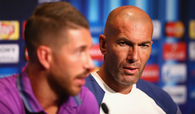 TRONDHEIM, NORWAY - AUGUST 08: In this handout image provided by UEFA, Sergio Ramos talks to the media as Head Coach Zinedan Zidane listens during the Real Madrid Press Conference at Lerkendal Stadion on August 8, 2016 in Trondheim, Norway. (Photo by Handout/UEFA via Getty Images)