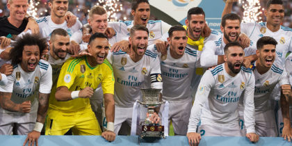 MADRID, SPAIN - AUGUST 16: Sergio Ramos of Real Madrid CF celebrates with teammates with the Supercopa de Espana trophy after beating FC Barcelona 2-0 (3-1) on aggregate in the Supercopa de Espana Final 2nd Leg match between Real Madrid and FC Barcelona at Estadio Santiago Bernabeu on August 16, 2017 in Madrid, Spain. (Photo by Denis Doyle/Getty Images)