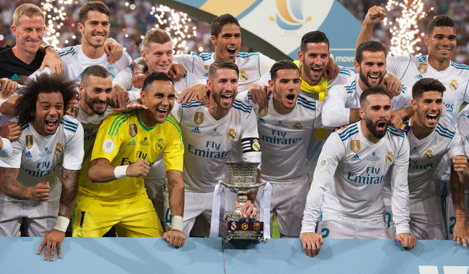 MADRID, SPAIN - AUGUST 16: Sergio Ramos of Real Madrid CF celebrates with teammates with the Supercopa de Espana trophy after beating FC Barcelona 2-0 (3-1) on aggregate in the Supercopa de Espana Final 2nd Leg match between Real Madrid and FC Barcelona at Estadio Santiago Bernabeu on August 16, 2017 in Madrid, Spain. (Photo by Denis Doyle/Getty Images)