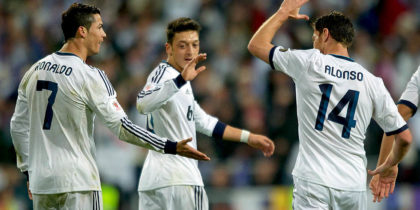 MADRID, SPAIN - MAY 17: Cristiano Ronaldo (L) of Real Madrid CF celebrates with teammates Mesut Ozil (C) and Xabi Alonso (R) after scoring the opening goal during the Copa del Rey Final match between Real Madrid CF and Club Atletico de Madrid at Estadio Santiago Bernabeu on May 17, 2013 in Madrid, Spain. (Photo by Gonzalo Arroyo/Getty Images)