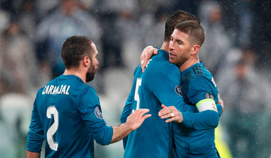 From left : Real Madrid's Spanish defender Dani Carvajal, Real Madrid's French defender Raphael Varane, Real Madrid's Spanish defender Sergio Ramos and Real Madrid's Brazilian defender Marcelo celebrate at the end of the UEFA Champions League quarter-final first leg football match between Juventus and Real Madrid at the Allianz Stadium in Turin on April 3, 2018.