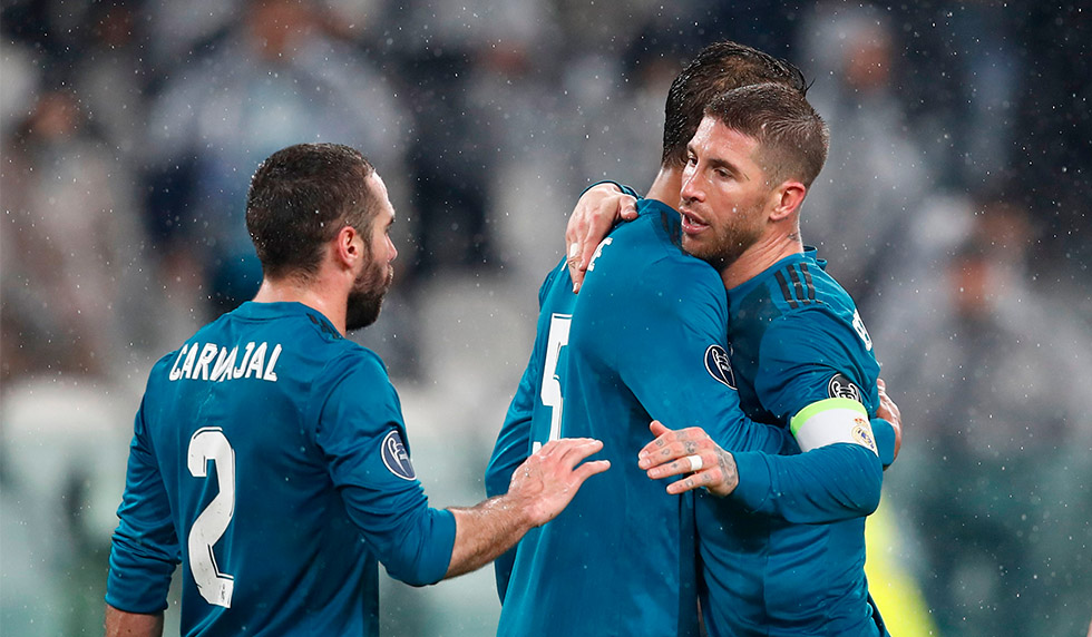 From left : Real Madrid's Spanish defender Dani Carvajal, Real Madrid's French defender Raphael Varane, Real Madrid's Spanish defender Sergio Ramos and Real Madrid's Brazilian defender Marcelo celebrate at the end of the UEFA Champions League quarter-final first leg football match between Juventus and Real Madrid at the Allianz Stadium in Turin on April 3, 2018.