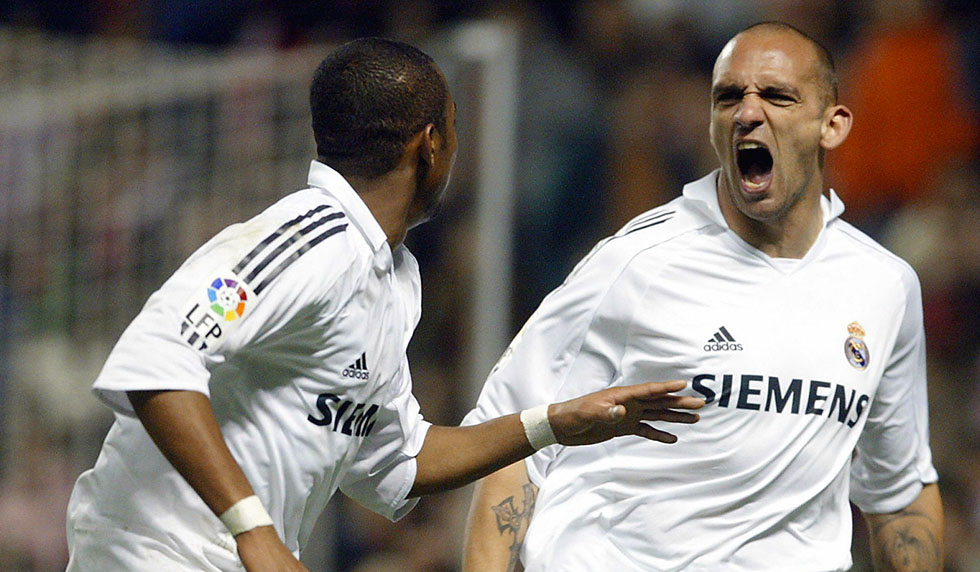 Bilbao, SPAIN: Real Madrid's Raul Bravo (R) celebrates his goal, the team's second, with his teammate Robinho (L) who scored the first, 11 February 2006, during a Spanish league football match at the San Mames stadium, in Bilbao. Real Madrid won 2-0. AFP PHOTO / Rafa RIVAS (Photo credit should read RAFA RIVAS/AFP/Getty Images)