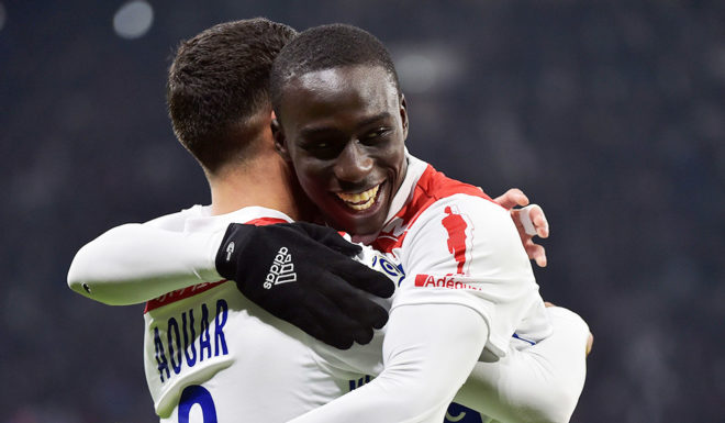 Lyon's French midfielder Houssem Aouar (L) celebrates after scoring a goal with Lyon's French defender Ferland Mendy (R) during the French L1 football match between Lyon (OL) and Monaco (ASM) on December 16, 2018, at the Groupama Stadium in Decines-Charpieu near Lyon, central-eastern France. (Photo by ROMAIN LAFABREGUE / AFP) (Photo credit should read ROMAIN LAFABREGUE/AFP/Getty Images)