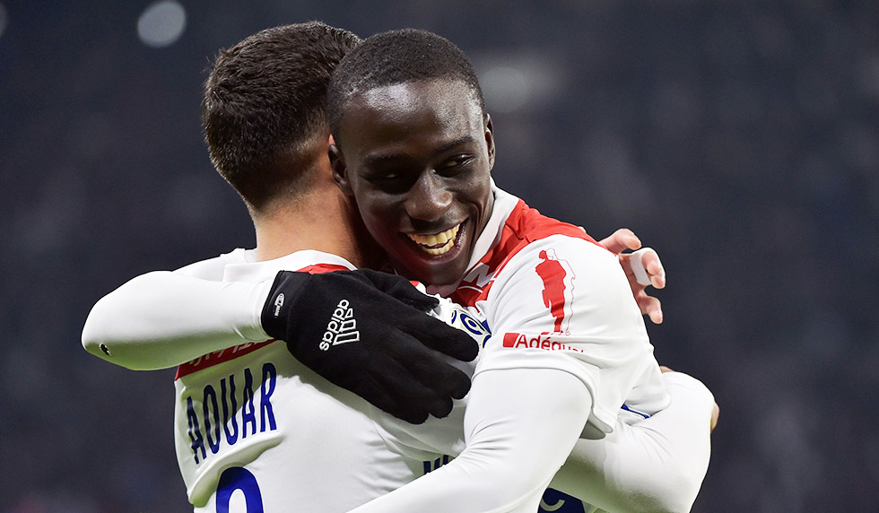 Lyon's French midfielder Houssem Aouar (L) celebrates after scoring a goal with Lyon's French defender Ferland Mendy (R) during the French L1 football match between Lyon (OL) and Monaco (ASM) on December 16, 2018, at the Groupama Stadium in Decines-Charpieu near Lyon, central-eastern France. (Photo by ROMAIN LAFABREGUE / AFP) (Photo credit should read ROMAIN LAFABREGUE/AFP/Getty Images)
