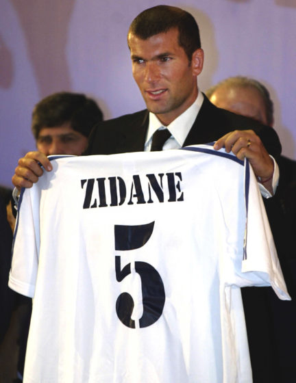 Zinédine Zidane French soccer star Zinedine Zidane displays his new Real Madrid soccer club jersey during the presentation of Zidane as the new team player in Madrid on Monday 09 July 2001. AFP PHOTO MARC ALEX (Photo credit should read MARC ALEX/AFP/Getty Images)