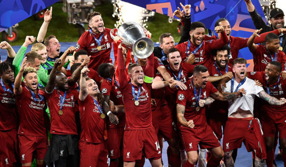 Liverpool's players celebrate with the trophy after winning the UEFA Champions League final football match between Liverpool and Tottenham Hotspur at the Wanda Metropolitan Stadium in Madrid on June 1, 2019. (Photo by OSCAR DEL POZO / AFP) (Photo credit should read OSCAR DEL POZO/AFP/Getty Images)