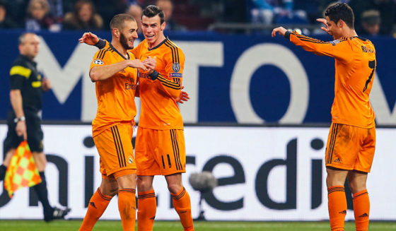 Karim Benzema, Gareth Bale, Cristiano Ronaldo GELSENKIRCHEN, GERMANY - FEBRUARY 26: Karim Benzema of Madrid celebrates his team's fourth goal with team mates Gareth Bale and Cristiano Ronaldo (L-R) during the UEFA Champions League Round of 16 first leg match between FC Schalke 04 and Real Madrid at Veltins-Arena on February 26, 2014 in Gelsenkirchen, Germany. (Photo by Alex Grimm/Bongarts/Getty Images)