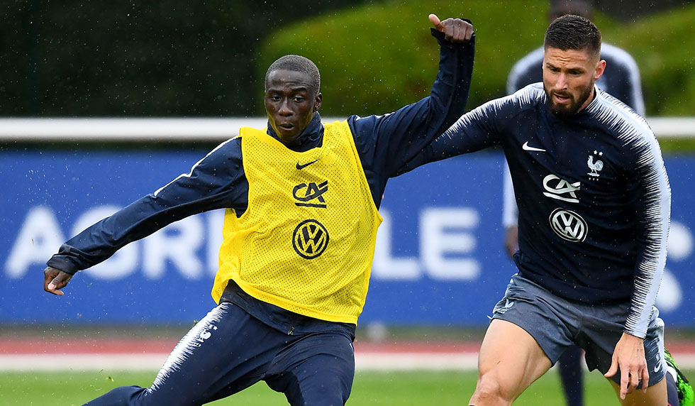 France's national football team forward Olivier Giroud (R) vies for the ball with defender Ferland Mendy during a training session in Clairefontaine en Yvelines on June 5, 2019 as part of the team's preparation for the upcoming Euro 2020 qualification matches against Turkey and Andorra. (Photo by FRANCK FIFE / AFP) (Photo credit should read FRANCK FIFE/AFP/Getty Images)