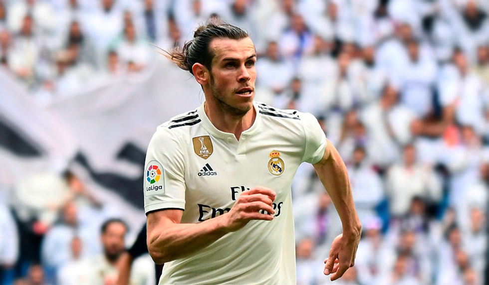 Real Madrid's Welsh forward Gareth Bale eyes the ball during the Spanish league football match between Real Madrid CF and SD Eibar at the Santiago Bernabeu stadium in Madrid on April 6, 2019. (Photo by GABRIEL BOUYS / AFP) (Photo credit should read GABRIEL BOUYS/AFP/Getty Images)