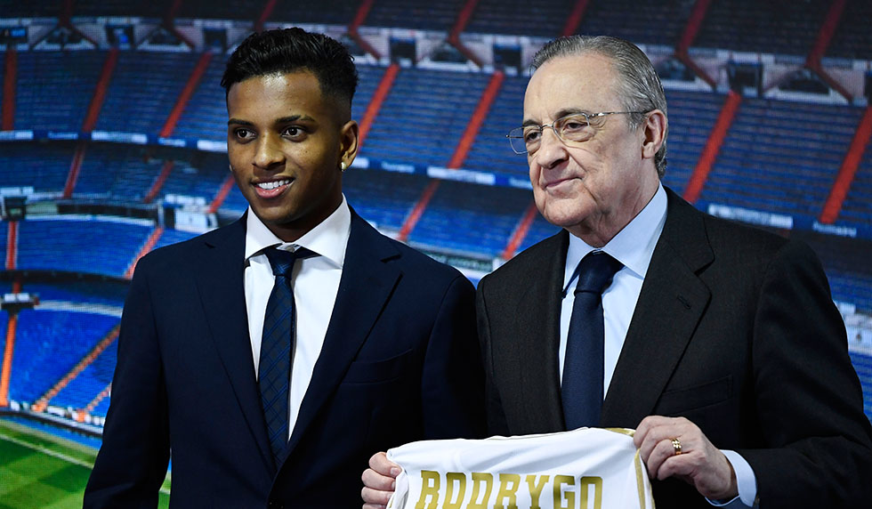 Brazilian forward Rodrygo Silva de Goes (L) and Real Madrid's president Florentino Perez pose during the official presentation of the footballer as new player of the Spanish club at the Santiago Bernabeu stadium in Madrid on June 18, 2019. (Photo by OSCAR DEL POZO / AFP) (Photo credit should read OSCAR DEL POZO/AFP/Getty Images)