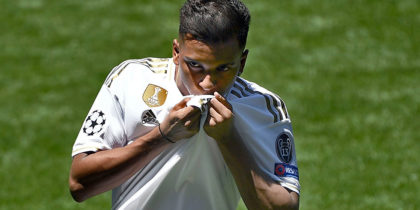 Brazilian forward Rodrygo Silva de Goes kisses his new jersey during his official presentation as new player of the Real Madrid CF at the Santiago Bernabeu stadium in Madrid on June 18, 2019. (Photo by OSCAR DEL POZO / AFP) (Photo credit should read OSCAR DEL POZO/AFP/Getty Images)