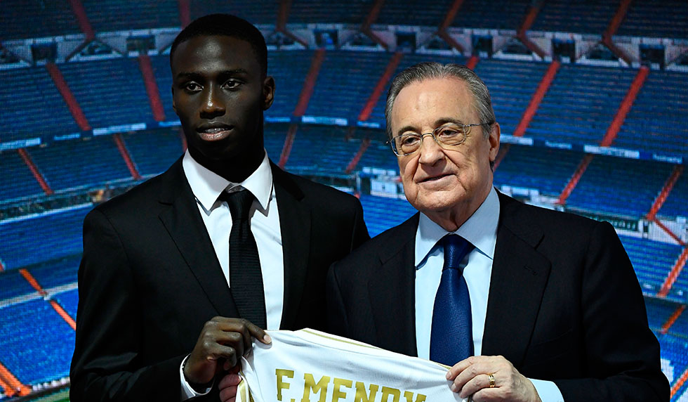 French defender Ferland Mendy (L) and Real Madrid's president Florentino Perez pose during the official presentation of the footballer as new player of the Spanish club at the Santiago Bernabeu stadium in Madrid on June 19, 2019. (Photo by OSCAR DEL POZO / AFP) (Photo credit should read OSCAR DEL POZO/AFP/Getty Images)