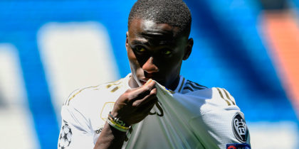 French defender Ferland Mendy kisses his new jersey during his official presentation as Real Madrid as new player of the Spanish club at the Santiago Bernabeu stadium in Madrid on June 19, 2019. (Photo by OSCAR DEL POZO / AFP) (Photo credit should read OSCAR DEL POZO/AFP/Getty Images)