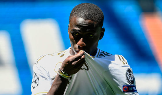 Ferland Mendy French defender Ferland Mendy kisses his new jersey during his official presentation as Real Madrid as new player of the Spanish club at the Santiago Bernabeu stadium in Madrid on June 19, 2019. (Photo by OSCAR DEL POZO / AFP) (Photo credit should read OSCAR DEL POZO/AFP/Getty Images)