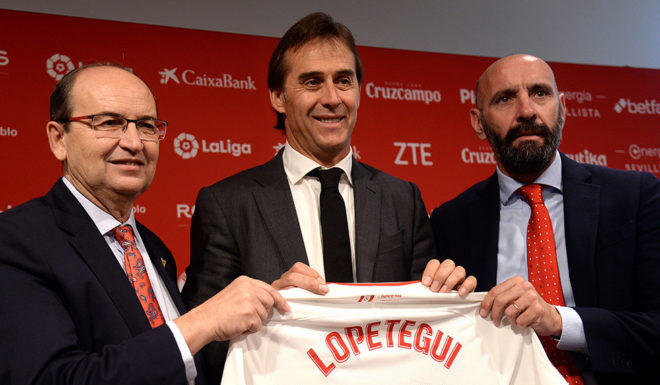 Julen Lopetegui (C) poses with the president of Sevilla FC, Jose Castro (L) and the team's director of football, Monchi, during Lopetegui's presentation as new head coach of Sevilla FC at the Ramon Sanchez Pizjuan stadium in Seville on June 5, 2019. - Sevilla signed Julen Lopetegui, who was sacked as Spain coach on the eve of the 2018 World Cup, as manager for the next three seasons. The 52-year-old, who had been out of work since Real Madrid also fired him at the end of October thanks to a dreadful start to the season, will take over from Joaquin Caparros. (Photo by CRISTINA QUICLER / AFP) (Photo credit should read CRISTINA QUICLER/AFP/Getty Images)