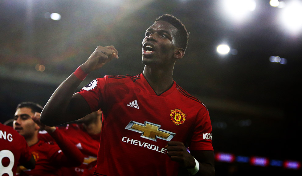 Manchester United's French midfielder Paul Pogba celebrates after Manchester United's English midfielder Jesse Lingard scores their fifth goal during the English Premier League football match between between Cardiff City and Manchester United at Cardiff City Stadium in Cardiff, south Wales on December 22, 2018. - Manchester United won the game 5-1. (Photo by Geoff CADDICK / AFP) / RESTRICTED TO EDITORIAL USE. No use with unauthorized audio, video, data, fixture lists, club/league logos or 'live' services. Online in-match use limited to 120 images. An additional 40 images may be used in extra time. No video emulation. Social media in-match use limited to 120 images. An additional 40 images may be used in extra time. No use in betting publications, games or single club/league/player publications. / (Photo credit should read GEOFF CADDICK/AFP/Getty Images)