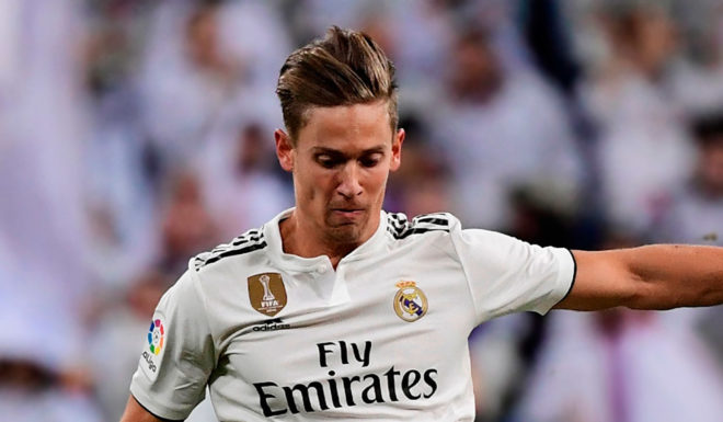 Real Madrid's Spanish miedfieder Marcos Llorente (L) vies for the ball with Girona's Spanish midfielder Alex Granell during the Spanish Copa del Rey (King's Cup) quarter-final first leg football match between Real Madrid CF and Girona FC at the Santiago Bernabeu stadium in Madrid on January 24, 2019. (Photo by JAVIER SORIANO / AFP) (Photo credit should read JAVIER SORIANO/AFP/Getty Images)