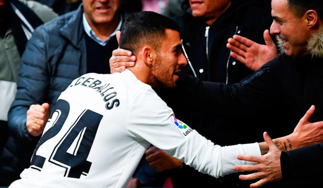 Real Madrid's Spanish midfielder Daniel Ceballos (C) is congratulated at the end of the Spanish league football match between Club Atletico de Madrid and Real Madrid CF at the Wanda Metropolitano stadium in Madrid on February 9, 2019. (Photo by GABRIEL BOUYS / AFP) (Photo credit should read GABRIEL BOUYS/AFP/Getty Images)