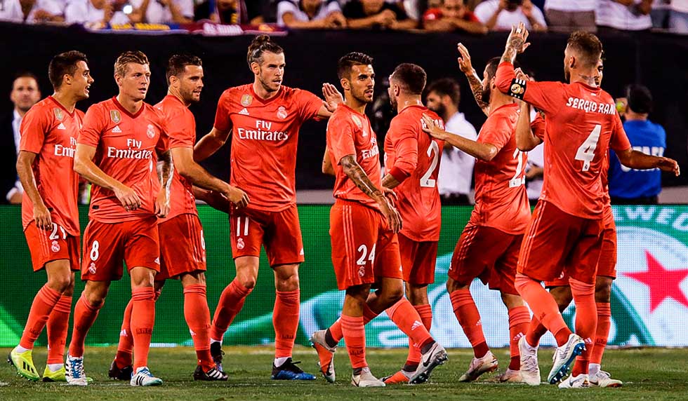 Real Madrid's Welsh forward Gareth Bale celebrates his goal with his teammates against AS Roma during their 2018 International Champions Cup at the MetLife stadium on August 07, 2018, in East Rutherford, NJ. (Photo by EDUARDO MUNOZ ALVAREZ / AFP) (Photo credit should read EDUARDO MUNOZ ALVAREZ/AFP/Getty Images)