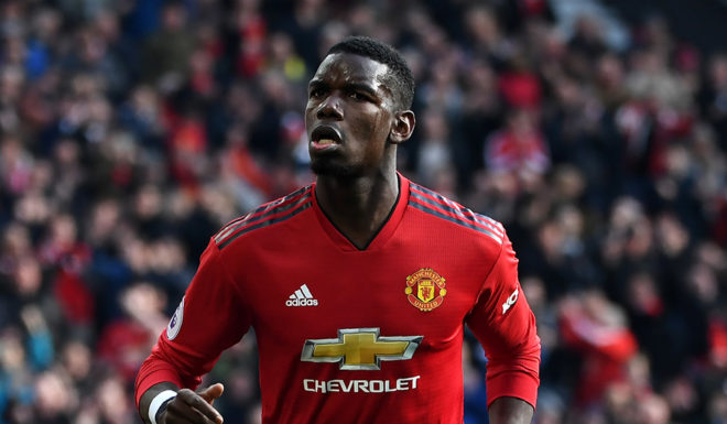 Manchester United's French midfielder Paul Pogba celebrates after he scores the team's first goal during the English Premier League football match between Manchester United and West Ham United at Old Trafford in Manchester, north west England, on April 13, 2019. (Photo by Paul ELLIS / AFP) / RESTRICTED TO EDITORIAL USE. No use with unauthorized audio, video, data, fixture lists, club/league logos or 'live' services. Online in-match use limited to 120 images. An additional 40 images may be used in extra time. No video emulation. Social media in-match use limited to 120 images. An additional 40 images may be used in extra time. No use in betting publications, games or single club/league/player publications. / (Photo credit should read PAUL ELLIS/AFP/Getty Images)