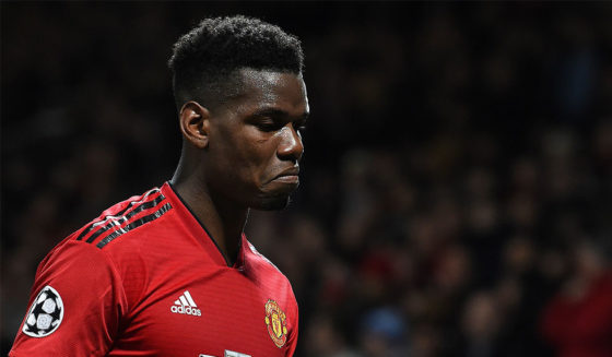 TOPSHOT - Manchester United's French midfielder Paul Pogba leaves the pitch after being shown a red card during the first leg of the UEFA Champions League round of 16 football match between Manchester United and Paris Saint-Germain (PSG) at Old Trafford in Manchester, north-west England on February 12, 2019. - PSG won the match 2-0. (Photo by Paul ELLIS / AFP) (Photo credit should read PAUL ELLIS/AFP/Getty Images)