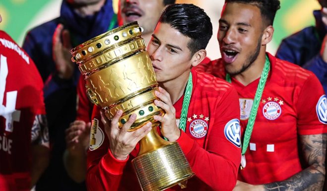 James Rodriguez BERLIN, GERMANY - MAY 25: James Rodriquez of Bayern Muenchen lifts the trophy in celebration with team mates after the DFB Cup final between RB Leipzig and Bayern Muenchen at Olympiastadion on May 25, 2019 in Berlin, Germany. (Photo by Alexander Hassenstein/Bongarts/Getty Images)