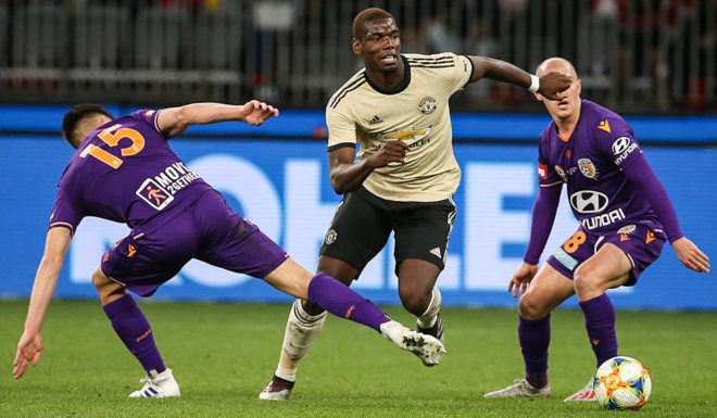 Paul Pogba PERTH, AUSTRALIA - JULY 13: Paul Pogba of Manchester United controls the ball against Brandon Wilson and Neil Kilkenny of the Glory during the match between the Perth Glory and Manchester United at Optus Stadium on July 13, 2019 in Perth, Australia. (Photo by Paul Kane/Getty Images)
