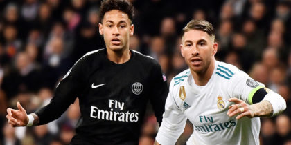 Real Madrid's Spanish defender Sergio Ramos (R) vies with Paris Saint-Germain's Brazilian forward Neymar (C) AS Real Madrid's German midfielder Toni Kroos approaches during the UEFA Champions League round of sixteen first leg football match Real Madrid CF against Paris Saint-Germain (PSG) at the Santiago Bernabeu stadium in Madrid on February 14, 2018. / AFP PHOTO / CHRISTOPHE SIMON (Photo credit should read CHRISTOPHE SIMON/AFP/Getty Images)