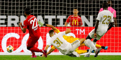Bayern Munich midfielder Serge Gnabry (C) scores a goal against Real Madrid during their International Champions Cup match on July 20, 2019 at NRG Stadium in Houston, Texas. (Photo by AARON M. SPRECHER / AFP) / The erroneous mention appearing in the metadata of this photo by AARON M. SPRECHER has been modified in AFP systems in the following manner: [Bayern Munich midfielder Serge Gnabry (C) scores a goal ] instead of [Bayern Munich defender Jerome Boateng (C) scores a goal]. Please immediately remove the erroneous mention from all your online services and delete it from your servers. If you have been authorized by AFP to distribute it to third parties, please ensure that the same actions are carried out by them. Failure to promptly comply with these instructions will entail liability on your part for any continued or post notification usage. Therefore we thank you very much for all your attention and prompt action. We are sorry for the inconvenience this notification may cause and remain at your disposal for any further information you may require. (Photo credit should read AARON M. SPRECHER/AFP/Getty Images)