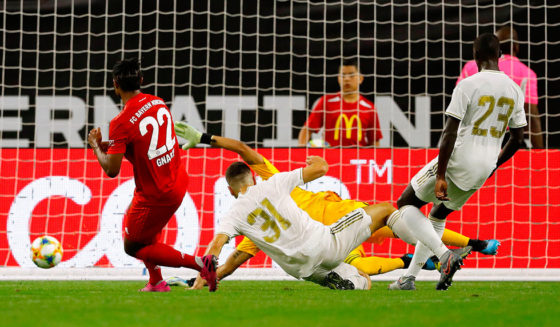 Bayern Munich midfielder Serge Gnabry (C) scores a goal against Real Madrid during their International Champions Cup match on July 20, 2019 at NRG Stadium in Houston, Texas. (Photo by AARON M. SPRECHER / AFP) / The erroneous mention appearing in the metadata of this photo by AARON M. SPRECHER has been modified in AFP systems in the following manner: [Bayern Munich midfielder Serge Gnabry (C) scores a goal ] instead of [Bayern Munich defender Jerome Boateng (C) scores a goal]. Please immediately remove the erroneous mention from all your online services and delete it from your servers. If you have been authorized by AFP to distribute it to third parties, please ensure that the same actions are carried out by them. Failure to promptly comply with these instructions will entail liability on your part for any continued or post notification usage. Therefore we thank you very much for all your attention and prompt action. We are sorry for the inconvenience this notification may cause and remain at your disposal for any further information you may require. (Photo credit should read AARON M. SPRECHER/AFP/Getty Images)