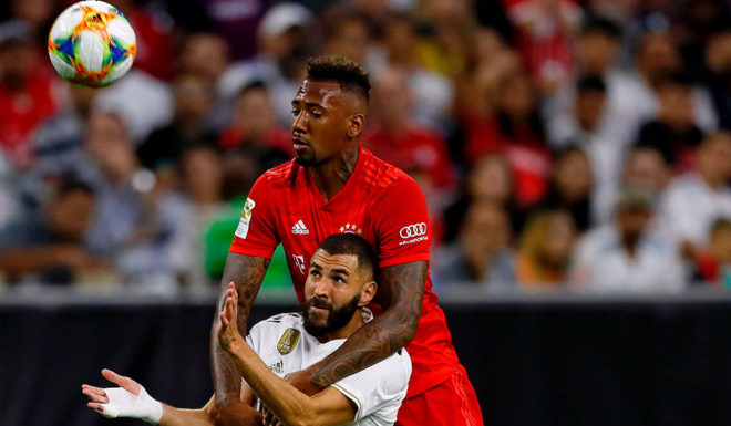 Karim Benzema Real Madrid forward Karim Benzema (L) and Bayern Munich defender Jerome Boateng fight for the ball during their International Champions Cup match on July 20, 2019 at NRG Stadium in Houston, Texas. (Photo by AARON M. SPRECHER / AFP) (Photo credit should read AARON M. SPRECHER/AFP/Getty Images)