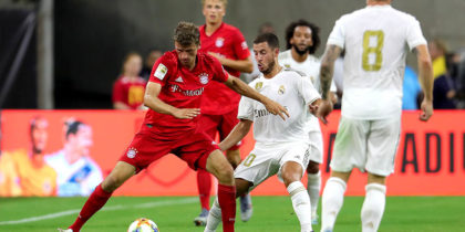 HOUSTON, TEXAS - JULY 20: Eden Hazard of Real battles for the ball with Thomas Mueller of Bayern Muenchen during the International Champions Cup match between Bayern Muenchen and Real Madrid in the 2019 International Champions Cup at NRG Stadium on July 20, 2019 in Houston, Texas. (Photo by Alexander Hassenstein/Bongarts/Getty Images)