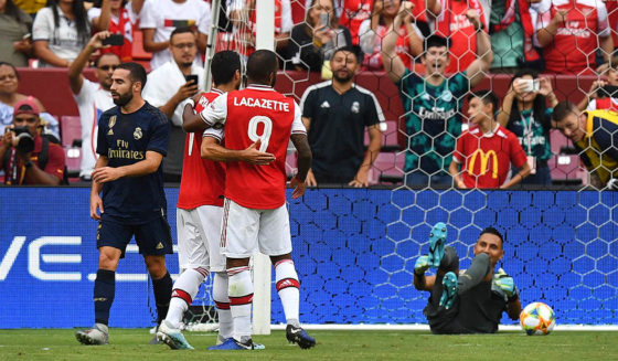 Arsenal's French striker Alexandre Lacazette (C) celebrates after scoring a goal against Real Madrid's Costa Rican goalkeeper Keylor Navas (R) during the International Champions Cup football match between Real Madrid and Arsenal at FedExField in Landover, Maryland, on July 23, 2019. (Photo by Jim WATSON / AFP) (Photo credit should read JIM WATSON/AFP/Getty Images)