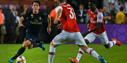 Real Madrid's Spanish defender Alvaro Odriozola (L) tries to get past Arsenal's German-born Bosnian defender Sead Kolasinac (C) during the International Champions Cup football match between Real Madrid and Arsenal at FedExField in Landover, Maryland, on July 23, 2019. (Photo by ANDREW CABALLERO-REYNOLDS / AFP) (Photo credit should read ANDREW CABALLERO-REYNOLDS/AFP/Getty Images)