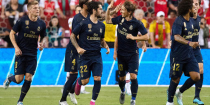 Real Madrid's players celebrate after defeating Arsenal during their International Champions Cup football match at FedExField in Landover, Maryland, on July 23, 2019. (Photo by Jim WATSON / AFP) (Photo credit should read JIM WATSON/AFP/Getty Images)