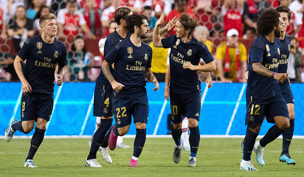 Real Madrid's players celebrate after defeating Arsenal during their International Champions Cup football match at FedExField in Landover, Maryland, on July 23, 2019. (Photo by Jim WATSON / AFP) (Photo credit should read JIM WATSON/AFP/Getty Images)
