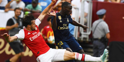 Arsenal's English defender Carl Jenkinson (L) fights for the ball with Real Madrid's French defender Ferland Mendy during the International Champions Cup football match between Real Madrid and Arsenal at FedExField in Landover, Maryland, on July 23, 2019. (Photo by Jim WATSON / AFP) (Photo credit should read JIM WATSON/AFP/Getty Images)