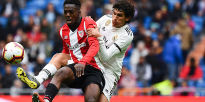 Athletic Bilbao's Spanish forward Inaki Williams (L) challenges Real Madrid's Spanish defender Jesus Vallejo during the Spanish League football match between Real Madrid and Athletic Bilbao at the Santiago Bernabeu Stadium in Madrid on April 21, 2019. (Photo by GABRIEL BOUYS / AFP) (Photo credit should read GABRIEL BOUYS/AFP/Getty Images)