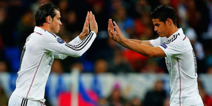 MADRID, SPAIN - NOVEMBER 04: Gareth Bale (L) of Real Madrid CF replaces team mate James Rodriguez (R) during the UEFA Champions League Group B match between Real Madrid CF and Liverpool FC at Estadio Santiago Bernabeu on November 4, 2014 in Madrid, Spain. (Photo by Gonzalo Arroyo Moreno/Getty Images)