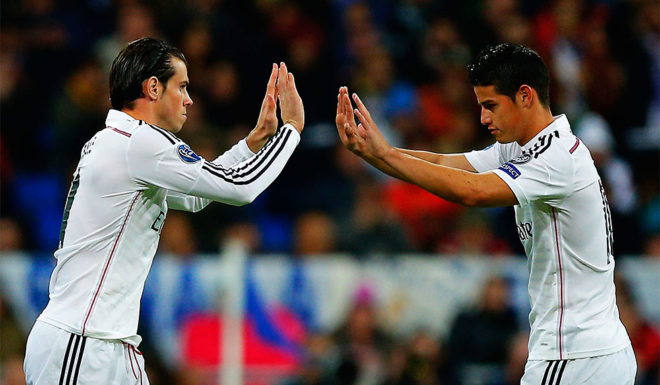 MADRID, SPAIN - NOVEMBER 04: Gareth Bale (L) of Real Madrid CF replaces team mate James Rodriguez (R) during the UEFA Champions League Group B match between Real Madrid CF and Liverpool FC at Estadio Santiago Bernabeu on November 4, 2014 in Madrid, Spain. (Photo by Gonzalo Arroyo Moreno/Getty Images)