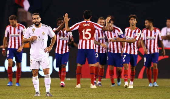Real Madrid's Dani Carvajal (L) reacts after a goal from Atletico Madrid during the 2019 International Champions Cup football match between Real Madrid and Atletico Madrid at the Metlife Stadium Arena in East Rutherford, New Jersey on July 26, 2019. (Photo by Johannes EISELE / AFP) (Photo credit should read JOHANNES EISELE/AFP/Getty Images)