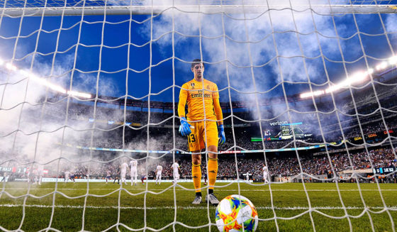 Thibaut Courtois Real Madrid's Belgian goalkeeper Thibaut Courtois takes the ball after failing to save a goal during the 2019 International Champions Cup football match between Real Madrid and Atletico Madrid at the Metlife Stadium Arena in East Rutherford, New Jersey on July 26, 2019. (Photo by Johannes EISELE / AFP) (Photo credit should read JOHANNES EISELE/AFP/Getty Images)