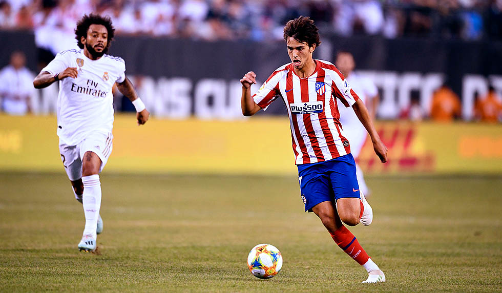 Real Madrid's Brazilian defender Marcelo (L) runs after Atletico Madrid's Portuguese midfielder Joao Felix as he controls the ball during their 2019 International Champions Cup football match between Real Madrid and Atletico Madrid at the Metlife Stadium Arena in East Rutherford, New Jersey on July 26, 2019. (Photo by Johannes EISELE / AFP) (Photo credit should read JOHANNES EISELE/AFP/Getty Images)