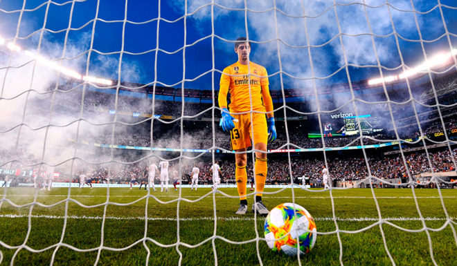 Real Madrid's Belgian goalkeeper Thibaut Courtois takes the ball after failing to save a goal during the 2019 International Champions Cup football match between Real Madrid and Atletico Madrid at the Metlife Stadium Arena in East Rutherford, New Jersey on July 26, 2019. (Photo by Johannes EISELE / AFP) (Photo credit should read JOHANNES EISELE/AFP/Getty Images)